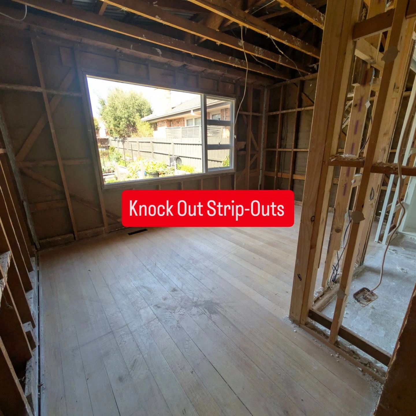 Unfinished room with framing and window view